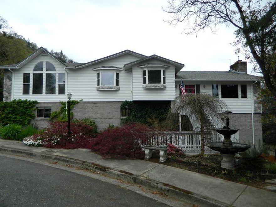 Awesome Views of Grants Pass and surrounding Mountains, Totally remodeled and updated. 3030 sqft 3 bdrm 3 bath Tri level home on .28 acre lot. Elaborate water feature in front yard with fountain. Kitchen features granite counters, painted cabinets, center island, cooktop and dbl ovens. Great room with fireplace and views of town. Master bedroom boost of vaulted ceilings, arched windows, walk in closet, dbl sinks in bathroom, jetted tub with tile surround, and shower. Family room with pellet stove and room for the pool table. laundry room. 3 car garage, shop, Extensive decking, Sprinkler system hooked to GPID 2 heat pumps, new interior paint. Move in ready. 2nd tax lot .37acre available for a 2 family setup.