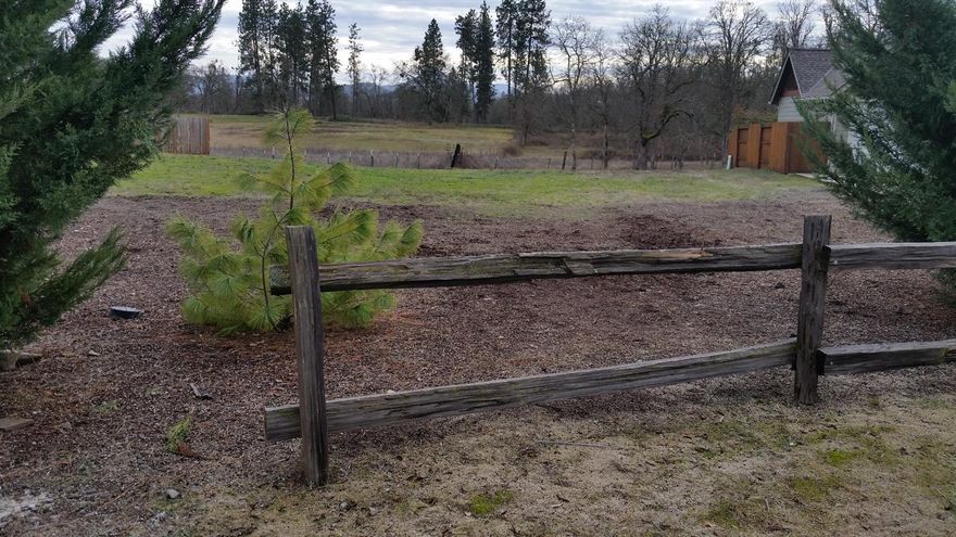 Large level lot in the desirable Echoes of the Ponderosa Subdivision, which is right across the road from the Eagle Point Golf Course!! This lot is located directly across from the park, on the corner and backs up to large EFU acreage with nice view and lots of privacy. Come build your dream home here.
