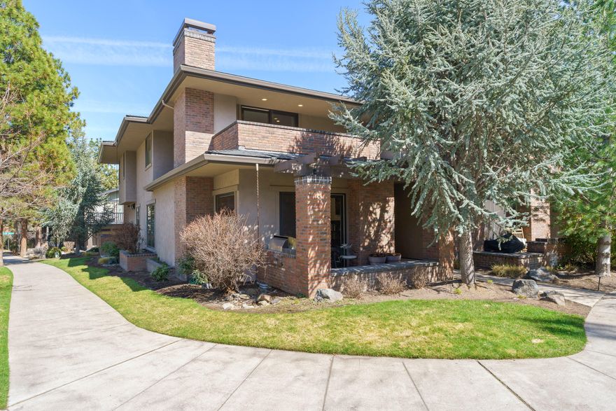 Stunning NW Contemporary Townhome in the heart of NorthWest Crossing, directly across from Compass Park! Nearly 3,000 SF of high-end craftsmanship with reclaimed hardwood floors, gourmet kitchen with Wolf range, commercial built-in fridge, beautiful honed granite countertops & walk-in pantry. Incredible oak woodwork throughout showcases the superior craftsmanship, along with high ceilings & extra-large windows, that flood the space with natural light. The home's open floor plan with great flow, large dining area & front patio w/built-in outdoor grill make it perfect for entertaining! All 3 spacious bedrooms are en-suite w/outdoor terraces, including a grand primary suite w/private terrace. Flex/Loft space for office or workout area. Lots of storage & oversized 2-car garage. ICF construction for quiet living.  Great location near the NWX Farmer's Market, Sparrow Bakery, The Grove & a variety of other shops, restaurants, & trails. Don't miss this one! Schedule a showing today!