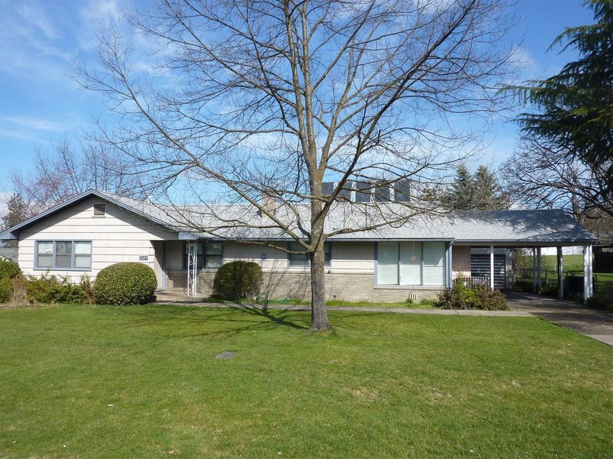 Rare find in great east Medford neighborhood. This 4 bedroom home has had the same owner for 64 years. Remarkable home with many improvements over time. You will save money on energy costs each month with double and triple pane windows. Open and airy kitchen, large living room with brick fireplace. The large corner lot has lots of landscaping, garden area, large covered patio and mature grapes. Lots of room for RVs and off street parking. You will love the convenient central location.