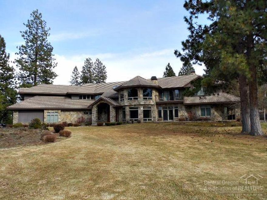 Incredible home in the desirable gated golf community of Sunset View Estates. This home features travertine flooring, granite slab counters, beautiful stone work, extensive custom wood work, theater room with whole house audio, game room, spa/sauna, elevator, and 4-car garage. The property borders Lost Tracks Golf Course, with its own private lake. One-year home warranty provided by the seller.