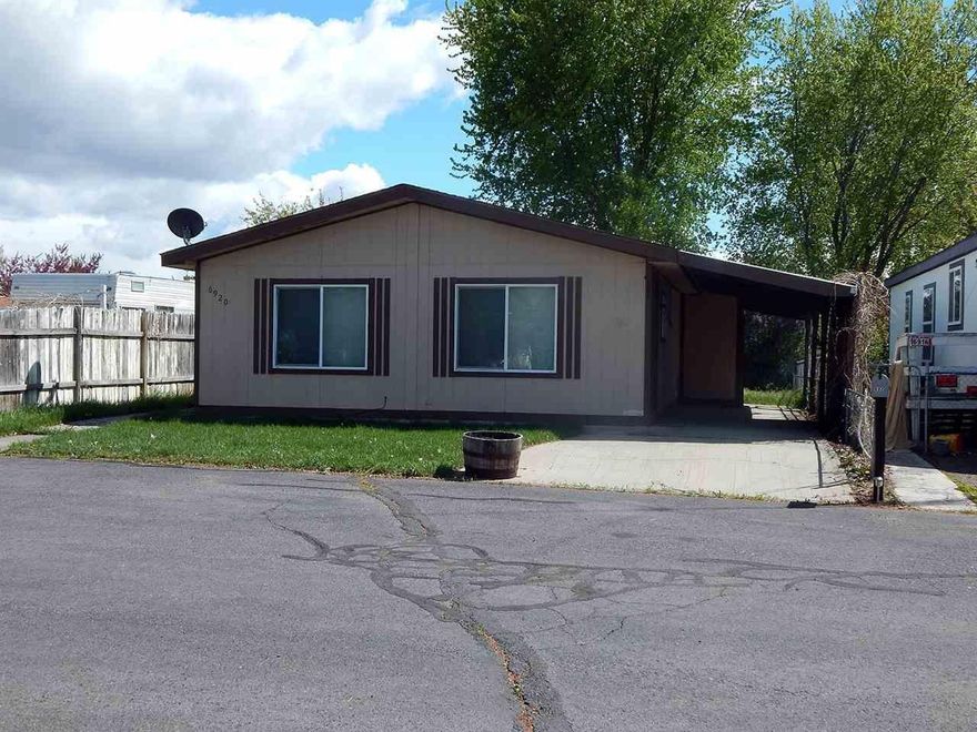 Nice 2 Bedroom, 1 Bath Home Located In Country Greens. This Home Has A Nice Backyard, Carport, New Laminate Flooring, Storage On The Side Of The Home. Located Close To Town, Easy To Show.