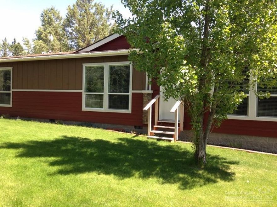 Home has many upgrades such as, knotty alder cabinets, 9 ft tray ceilings, energy star, desk and island in kitchen,raised counter tops satin nickel faucets,, natural light in closet and bathroom. It has a split floor plan with walk in closets in the bedrooms. Also bring all the animals, toys and family because this property offers a 30X40 shop and a 24X12 guest house too and has no CC&R's or HOA dues. Property is fenced and very private. Hurry it won't last long.