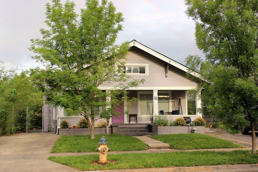 Beautifully updated single-level craftsman home with all the modern amenities. Updated electric & plumbing throughout, newer light fixtures, insulation added to walls, crawlspace & attic. 30-yr roof & paint in 2016. Custom cabinets & granite countertops throughout kitchen, laundry & bathroom, tile & wood laminate floors, carpet in bedrooms. Newer HVAC system & EPA certified wood stove. Kitchen has a large island with newer appliances. Newer windows, lots of light in the kitchen & bedrooms. Built in 1910 with 2 large bedrooms & 1 bath, open floor plan from kitchen into dining area & living room. Large unfinished attic with plenty of storage space. Water feature & stone walls surround back patio, charming covered front porch. 12x10 high quality shed with power, insulation & loft for storage. Gazebo w/ jetted tub, garden beds, fenced dog run & room for shop or ADU in back yard. Quiet cul-de-sac just 1 block from Washington Elementary & conveniently located to shopping off Stewart Ave.