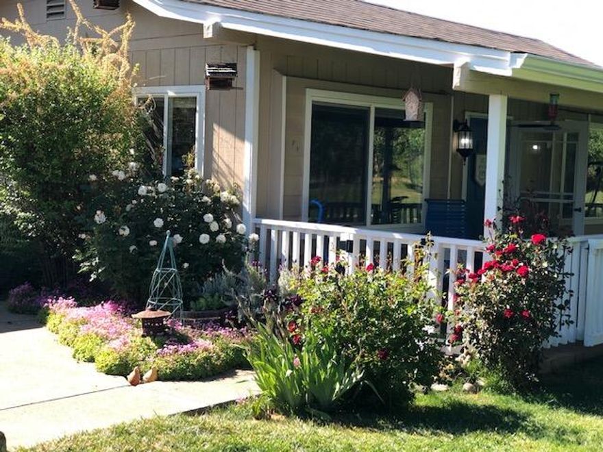 Super cute, well maintained country home on 2.13 acres. Beautiful landscaping with creek and year round pond to enjoy. 500 sq ft shop and two car carport. Large paved driveway with plenty of room for turn around. RV pad, plenty of room for toys. Flat usable acreage. Close to schools, easy access to town. Room for animals, fully fenced. 40 GPM well per owner.