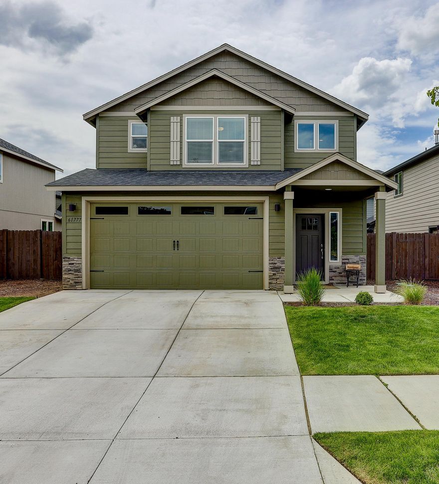 Like new and lightly lived in, 61777 Camellia Street exudes natural light and an abundance of upgrades near  Gardenside Park.  Covered porch with recessed lighting for those quiet nights at home.  Gorgeous tile surround fireplace in the great room and a kitchen that boasts an abundance of counter and pantry space. An inviting entry, vaulted ceilings and a spacious master bedroom. Laundry room complete with utility sink and room for storage. Extended garage, A/C, upgraded windows, flooring, hard surfaces and more!