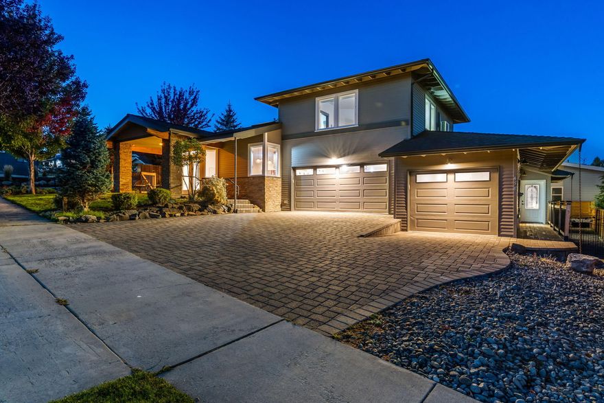 Don't miss this exceptional multi-generational living and investment opportunity on Awbrey Butte in this custom 4 bed, 3.5 bath home with 2,400+ sq ft of thoughtful design. Artistic wood finishes, including fir and walnut cabinetry, vaulted ceilings with exposed beams, stacked-stone fireplace, and newer LVP flooring add warmth and character. The main-level primary suite features a private patio - while a separate guest/In-Law quarters offers its own entrance with a full kitchen, bedroom, bathroom, laundry, and a garage - ideal for extended family, guests, or a home office. The flexible layout allows for privacy or integration with the main home. Located on a corner lot, sandwiched between Rivers Edge Golf Course and downtown Bend with views of distant peaks - this Prairie-style home offers versatility, quality, and timeless style in Bend's most desirable zip code.