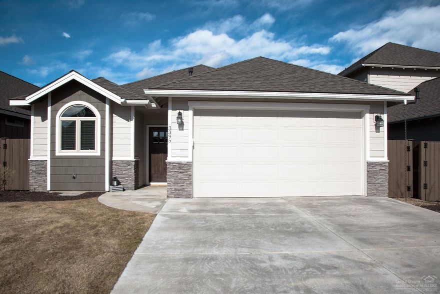 In the market for new construction with a south-facing driveway and next to a park, but don't want to pay for AC, fencing, gutters and landscaping? This is the house for you! Built in March 2018, this lightly lived-in and extremely well cared-for home is perfect for your young family, relocation, and/or retirement setting. Beautiful laminate flooring runs throughout the incredible great room - perfect for hosting and durable for all of life's messes. Step into the backyard and notice the handcrafted railing on the private deck, then take the steps down to the brick patio that's perfect for your outdoor dining and fireplace. Next to the patio is a perfect yard area for playing, Want a little more grass area? Step out front, head one house over, and run right into one of Bend's best kept secrets - Eagle Park. The community pool is right next door for those warm summer days. Don't miss this single-level charmer that's sure to be gone soon!<br><br>