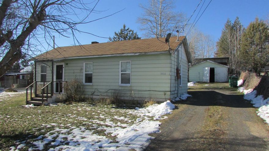 Don't miss this neat and tidy 2 bedroom, 1 bath cottage. 540 square foot unfinished garage, 192 square foot shed and a 24x36 shop with cement slab and 220 power. This is located close to town yet has a country feel.