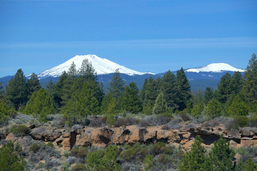 Discover a truly unparalleled opportunity to own nearly 13 acres of pristine land with panoramic views of the Cascade Mountains! Perched atop a dramatic rimrock ridge, this property boasts an elevated home-site that combines stunning scenery with ultimate privacy. Rarely does a property of this caliber come to market, offering the perfect blend of space, tranquility, and proximity to Bend's best attractions. Located just 4.5 miles from the lively Old Mill District and minutes from downtown Bend, it's one of the closest large-acreage properties you'll find. Whether you envision creating a luxurious private retreat, a family homestead, or a legacy property, this exceptional land offers endless possibilities. Don't let this rare find slip away!