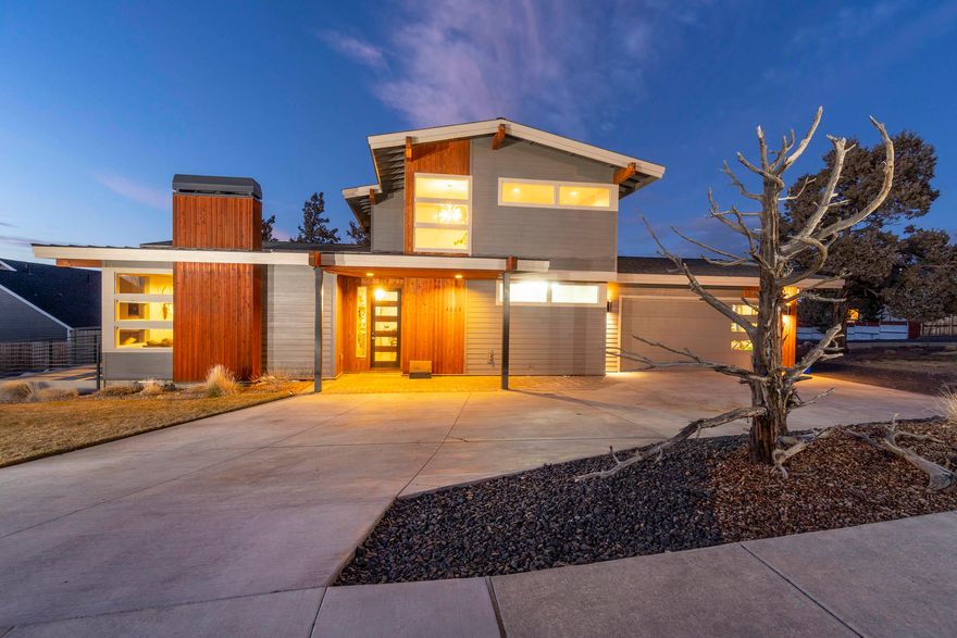 Truly Stunning Custom Home. A must see! Plenty of living space in this 2296 sq. ft. home, built in 2016. 4-bedroom, 2.5 bath with a flex area upstairs. Oversized 4 car garage with plenty of space for your garage gym or toys. Open floor plan for easy entertaining including a wet bar. Just a few amenities include: surround sound, radiant floor In master bath, seamless floors, beautiful tile shower, custom lighting and plumbing fixtures throughout home, tankless water heater, gas fireplace with tile surround, tile kitchen and bath countertops, central vac, and mountain views. Front and back yard landscaped with underground sprinklers. Paver front entry and patios with custom metalwork railing. Stainless appliances & much more. Home was designed by Central Oregon's own, The Shelter Studio.