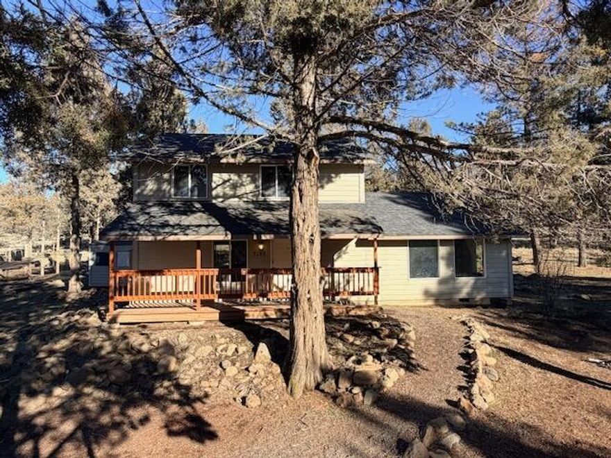Great, smaller acreage property with many amenities. Fantastic, sweeping, mountain and valley views. The property is gated and boasts several outbuildings, including a workshop, outdoor kitchen with built-in BBQ, kennel, garden area, play structure and a corral area that would be great for horses. The 2010 built 3/2 with an entire, upper 568 sq/ft, floor devoted to the primary suite with sitting area.  With BLM land nearby there are endless opportunities for horseback riding and exploration. Finish polishing this gem to make it your own.