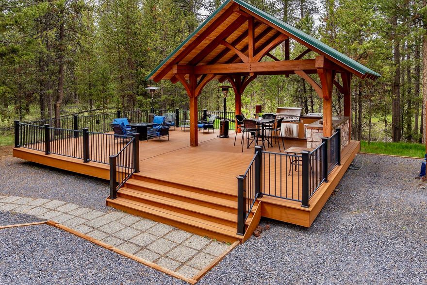 Outdoor Luxury & Privacy in Central Oregon - Build or Enjoy As-Is! 
Discover the perfect blend of outdoor living and modern comfort on this peaceful, forested .48-acre lot in OWW2. Just 10 minutes to Sunriver Resort, 25 minutes to Bend and 30 minutes to Mt. Bachelor!

The property features a true Timber Frame deck structure designed by the owner and built by Sisters Log Homes for over $40,000 in 2014. Deck space is  600 sq. ft.

Lot has been cleared, graveled, features 2 RV hookups and utilities are in place, saving you time and money.   This lot is ready to be built on and enjoyed! (Buyer to conduct all due diligence.)

HOA includes paved roads, snow removal, and private access to a marina and boat dock on the Deschutes River—perfect for boating, fishing, and water sports.

Enjoy wildlife from the deck or head out for world-class skiing, hiking, and mountain biking. Whether you're looking for a peaceful escape or a basecamp for adventure