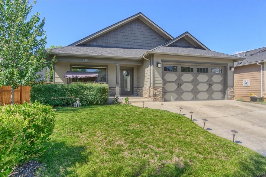 Come see this sophisticated, stand-out Central Point home! Custom built in 2014, over 2,000 sq ft, and ready for entertaining. You'll love the modern architectural angles & finishings. Open-concept common area is well-lit with high vaulted ceilings, and holds large crowds comfortably! Rough edge granite kitchen and island bar countertops, matching stainless steel appliances, large gas rangetop, and contemporary lighting fixtures. Follow the iron railing up the stairs to the bonus TV & game area in large loft overlooking the main level- includes wetbar, large closet/pantry, attic storage, and half bathroom. All bedrooms on main level! Master suite set at back of home with french doors to covered patio, walk in closet, and classy bathroom w/gorgeously tiled shower with river rock floor and dual shower head! Well built, covered front & back porches with can lighting to enjoy the outdoors year round. Schedule your appt. to view today!