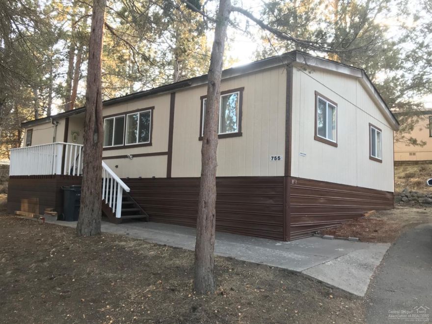 This home has been completed remodeled!!! Brand NEW roof, laminated wood flooring, sinks, toilets, cabinets, lighting & fixtures, appliances, high efficient heat pump, furnace, double pane vinyl windows and new paint inside and out. Kitchen island. Master with great separation and new wall cabinets too. Decks on both front and double deck on back. New Gravel in parking area for 3 vehicles. Storage shed included. Owner occupy only. No sublease. All occupants need park approval with credit and background checks. $730 Monthly space rent.