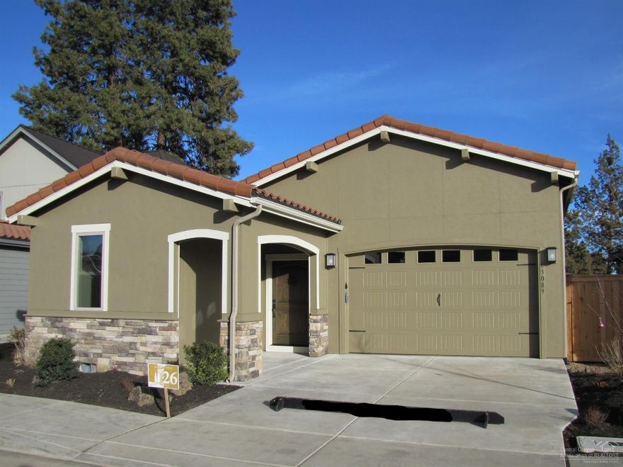 This gorgeous new single story home has a beautiful kitchen/dining area and spacious great room with fireplace. Kitchen features solid surface counters w/tile backsplash and stainless steel appliances. Full baths have solid surface counters & tile backsplashes. Master has double vanity & walk-in closet. Fenced, landscaped & covered back patio for outdoor living space. Exceptional neighborhood amenities include option to join pool & clubhouse. Why pay for upgrades when this home includes them!