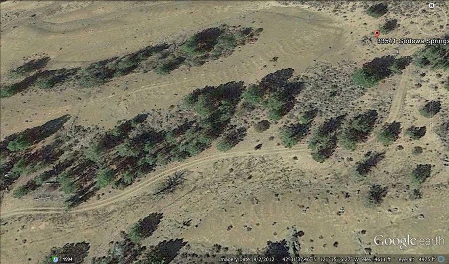 Paved County Road To Property - (Godowa Springs Road), Gravel Driveway. Property Is 1200' From Corner. Existing Conditional Use Permit. Large Shop 18'x20' With Carport Along Side, Built In 2005.