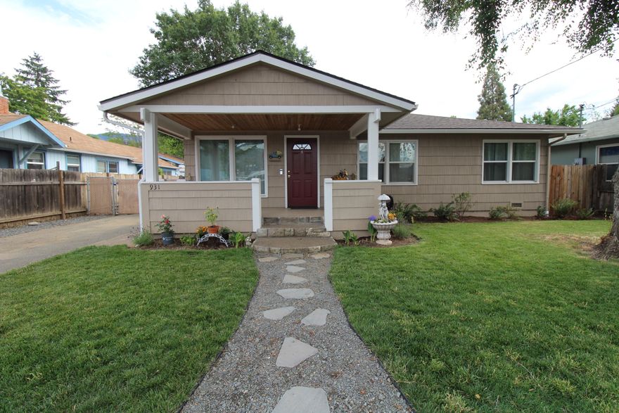 Cute as a button home with one of the best backyards you will find in town. This sweet 3 bedroom, 1 bath home sits on a large quarter acre lot and has been lovingly cared for through and through. It has loads of charm and features beautiful hardwood floors, large cased windows, a welcoming front porch, updated kitchen and bathroom, newer stainless steel appliances, a brand new roof on both the house + detached garage, as well as new insulation throughout. The backyard is what dreams are made of, with a massive back porch perfect for summer BBQs, a lush green lawn with inground sprinklers, raised garden beds and plenty of space further back for projects/hobbies, or maybe an ADU? Fully fenced for peace of mind and made complete with a dog run and space for chickens. Located close to the rogue river and down town. This little home is a gem, don't let it slip by! All information deemed reliable but not verified. Buyer to do their own due diligence.