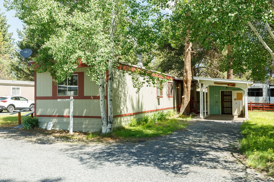 Riverview Park is a 55+ manufactured home park located on the north end of La Pine just 12 miles south of Sunriver, near shopping, dining, schools and medical services.   Water, sewer, garbage, landscaping and snow removal are all included in the monthly $ 750.00 space rent.  With 500 feet of Little Deschutes River frontage, now you can play where you live.  This home is freshly painted and with new flooring, plumbing and dishwasher is better than new.  On cold winter mornings you can cuddle up next to the certified woodstove.  This home also has covered parking, a covered firewood storage area and a small shed (with electricity). Come to La Pine to enjoy the Little Deschutes River and all the recreational opportunities it provides including fishing, swimming, canoeing and more.