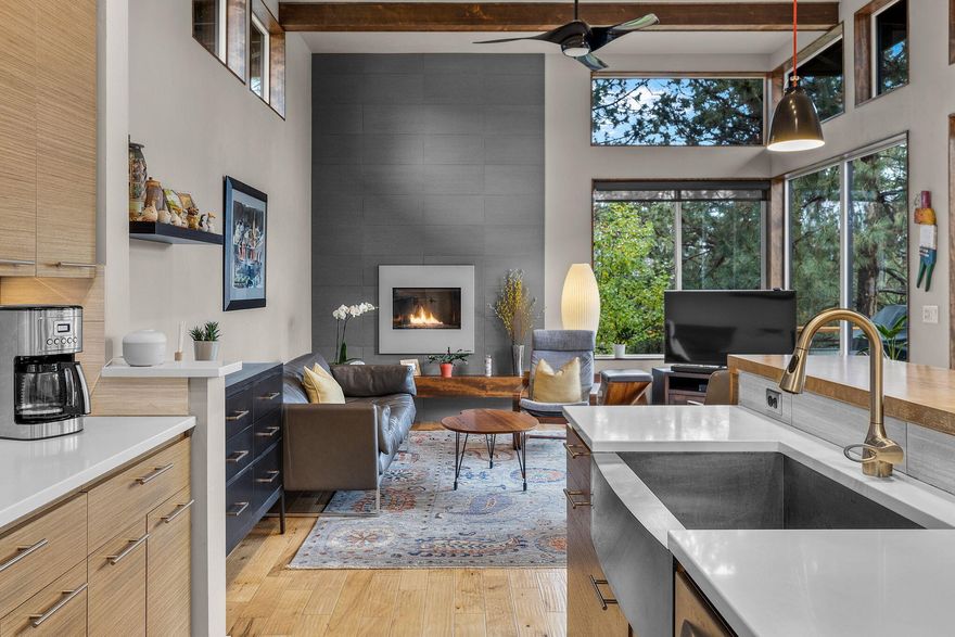 This stunning Mid-Century inspired modern home offers main-level living at its finest - perfect for everyday comfort and effortless entertaining. Designed with an open, flowing layout, it features expansive picturesque windows that flood the space with natural light. 12 foot ceilings! A true entertainer's dream, the spacious living areas and decks invite gatherings both large and small. With 4 generously sized bedrooms, including a primary suite on the main level and 3 on the lower level, 2 1/2 stylish bathrooms, a main level office with built-in wrap around desks and a laundry/mudroom that's truly a standout, every detail has been thoughtfully crafted. Tucked away in a quiet, well-cared-for neighborhood, this home combines tranquility with timeless sophistication. Two car garage, HUGE lower level gear room and bike/ski shop area. Fenced area off the lower level with raised garden beds on the south side. HOT TUB. Riding distance to trails/NWX/schools. 2 blocks to Quail Park.