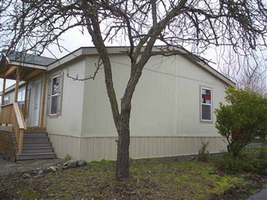 This 2005 manufactured home in Wingspread Park has never been lived in. The spacious kitchen has a large pantry. Other features include a master bath with vanity, vaulted ceilings and double paned windows. The siding has a 50 year warranty. The backyard over looks pasture land.