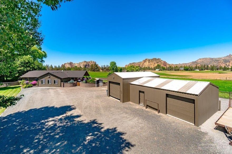 Knock out Smith Rock views from every place on this property! From doors to floors this home has been updated & includes slab granite counters, new JennAir kitchen appliances, automated window shades, new laminate hardwood, carpet, new roof, new exterior paint & a new heat pump. Enjoy the cozy living room with its Vermont casting propane stove, as well as the large bonus/family room and master bedroom. There is a 26W X 16L covered deck plus an amazing 1300+/- SF paver patio/outdoor living area, block privacy walls, mature landscaping and underground sprinklers. A 30W X 22L shop/garage with 10FT doors completes this small acreage. Fenced and cross fenced. Great Property + Great Views= A property you don't want to miss calling your own!