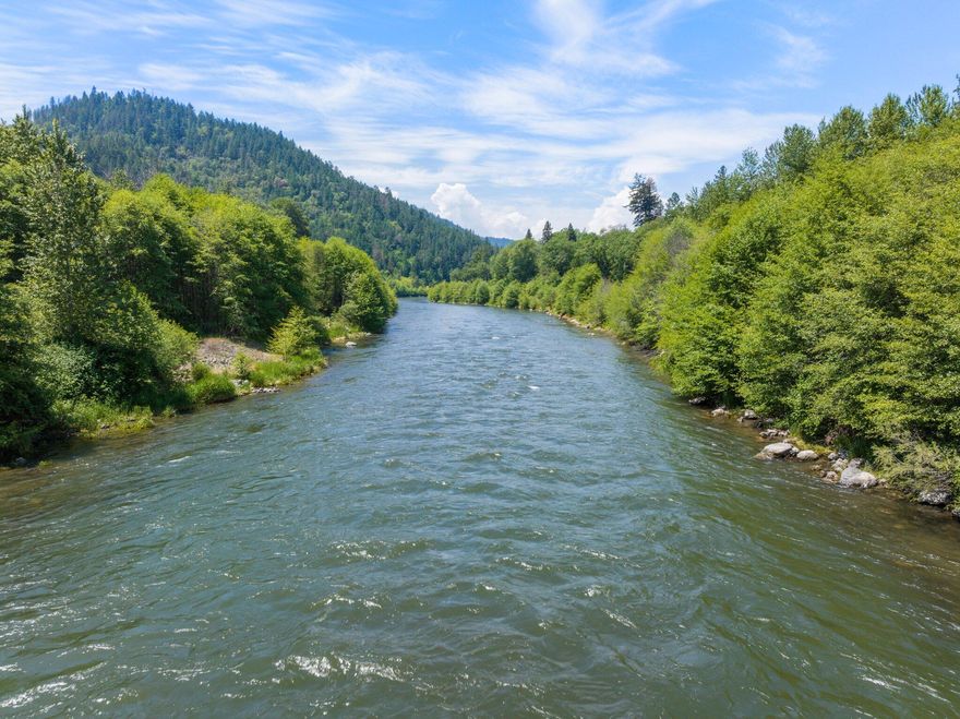 Hard To Find Rogue River Frontage Property. Own your own private retreat. The Scenic Rogue River is known for its great Steelhead and Salmon fishing. Easy Access to the banks of the Rogue River perfect to take your boat out or sit and relax in your own private oasis. This beautiful property boosts of room for 3 or more RV's, Power and a good producing well. Savage Creek Borders one side of the property. Fenced for privacy. The Seller's pride shows in this priced to sell property.