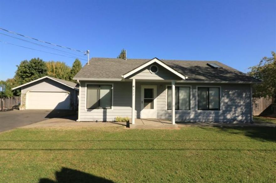 A Real Gem... if you've been house hunting, you know that it is hard to find an affordable, immaculate, well loved home in town! This one is not only a great looking home, it is on .25 acre, gated and fenced with a beautiful backyard! Living room, dining area, kitchen, laundry, and 2 bedrooms, 2 baths, including the master suite with mirrored closet doors, skylight, double sinks and shower. The Master Suite also includes your own private glass doors to the backyard and covered patio. Detached garage with garage door opener and pull through door to area for your boat or trailer, yard light, garden shed, and irrigation. Composition roof, double pane windows, ceiling fans, nice laminate and vinyl flooring, tile counter tops, refrigerator, range/oven combo and lots of charm! City schools, well, city sewer, cable available, close to shopping, medical facilities and more!