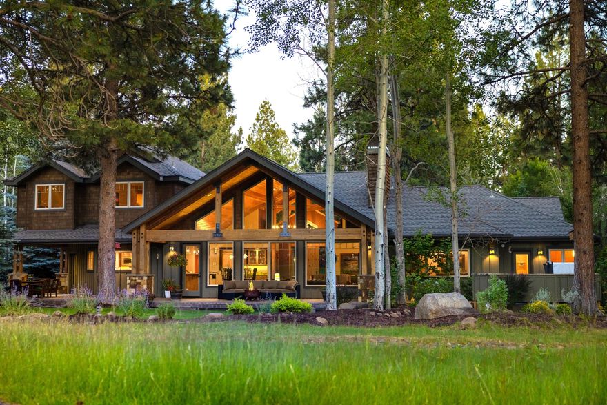 This stunning custom home at the end of a cul-de-sac in a gated neighborhood is excellent for entertaining and comfortable living. Walking in the front door you will be captivated by the vaulted ceilings showcasing a beautiful wall of windows with views of the 9th tee box & fairway of Aspen Lakes Golf Course. The gorgeous kitchen includes granite counter tops, ample cabinetry, high end appliances, and a large walk-in pantry.  The main level features a luxurious primary suite, guest room with full bathroom, large office with closet and built in desk that could serve as a 5th bedroom, powder bath, & large laundry room.  Upstairs offers two additional bedrooms, a full bathroom with double sinks, & bonus room with a beverage refrigerator.  The private .87-acre lot is beautifully landscaped with two water features, covered paver patio, hot tub, a new driveway, and an oversized 978 square feet 3 car garage.   This is an exceptional value priced $200K below a recent appraisal!