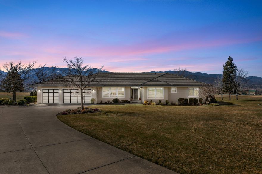 Welcome to your own private oasis! This impressive single level, 3060 square foot home offers breathtaking panoramic views of the city lights, vineyards, and Cascade Mountains. You will love the open kitchen that flows directly into a family room with plenty of natural light. The formal living and dining rooms provide a perfect space for entertaining guests alongside the vibrant views outside. Enjoy outdoor activities on your 21+ acres, 17 acres are irrigated with TID.  Zoned EFU, it makes a great space for putting in a vineyard, or growing hay for your horses!  (small hay barn is already here) This location between Ashland and Medford just can't be beat and makes for easy living.  Tile roof, great well (last tested at 11.8), new interior paint, new epoxy garage floor &  new whole house Reverse Osmosis System and new doors for the 3 car garage complete this package. Come experience all this property has to offer.