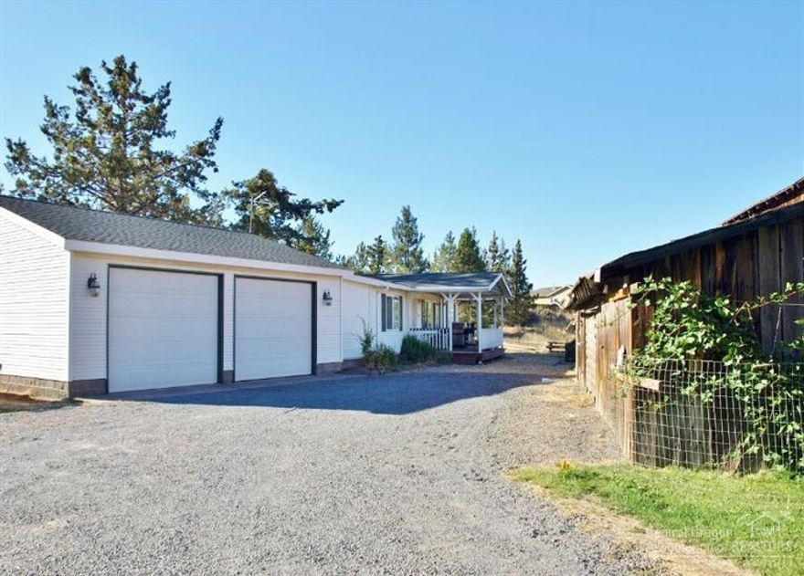 Imagine having room to roam, yet close to town. Well maintained property on .92 acre lot just off Cooley Rd. An open floor plan w/neutral colors. Good bedroom separation. The large master has a walk in closet. The larger utility room has ample shelves w/clothes racks & a breezeway that goes into the attached garage & out to the back deck. Enjoy an old historic barn, covered RV carport, vegetable garden w/sprinklers & drip system, greenhouse, deck & covered front deck. A perfect place to call home!!