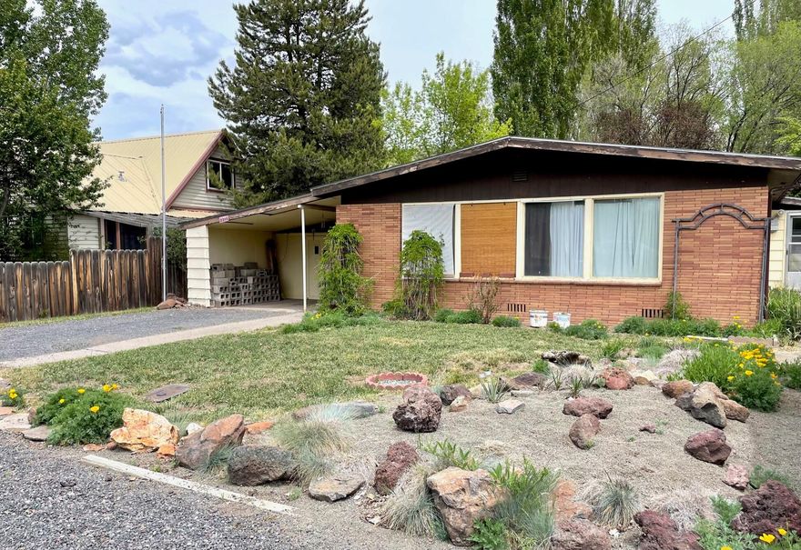 Come check out this well cared for 2 bedroom, 1 bathroom on a super spacious lot. Home has outbuildings including two 12' x 12' sheds with power, and 13' x 10' workshop with power and attached covered storage. There is also a large carport. New roof 2020. Most appliances are newer. This home is being sold as is.