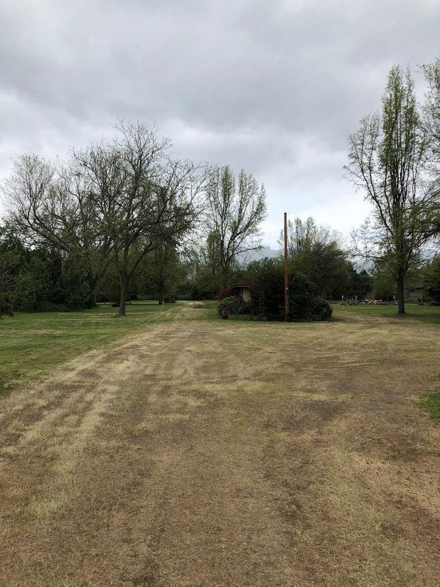 Multi-family development opportunity in Talent! High Density RM zoning property close to downtown Talent Oregon. Minutes from downtown Ashland and close to
Medford. Town homes or rowhouses also can be built in this zoning. A 1,600 square foot home sits on the North end of the property. With a little updating this could be a resident manager's home/office or Clubhouse. House and property are sold AS-IS, buyer to perform due diligence with City of Talent on use, approval process,