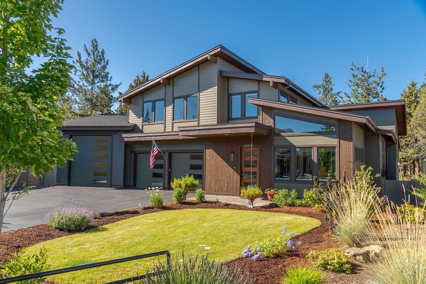 ''Live your best Central Oregon lifestyle.''  Custom-built Contemporary home nestled on a .52-acre lot. Ideal for outdoor & recreational enthusiasts. Offering seamless integration that blends indoor-outdoor living, while providing luxury & convenience. Soaring 10' to18' vaulted ceilings w/ generous window placement creating a bright atmosphere of functionality & inspiration. The main level offers an expansive kitchen, dining & LR, w/an Induction stove, walnut cabinets, PS appliance pkg, wine-fridge, pantry & more. The primary suite offers spa-style BR dual-shower heads, heated floors, heated towel racks & access to your outdoor spa & backyard haven. Upstairs is an impressive flex room or 5th BR+ office + 2 BR's all w/walk-in closets & full BA. An oversized epoxy coated 3-car garage including an RV bay, storage & shop. Rest under your covered Veranda, enjoying the fragrant shrubs, fresh berries, garden beds & fire pit. Accessible to Alpenglow Park, trails, schools & recreation.