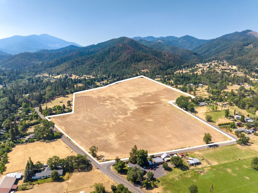 Welcome to High Valley Farm - a rare large acreage farm in the highly desired Wagner Creek Valley of Jackson County, Oregon. The expansive farm presents an extraordinary farming opportunity that spans 45 acres of productive Class II loam soil, boasts a level topography, efficient shape, & EFU zoning.  Water delivered from the Talent Irrigation District & its sought after location makes for an ideal offering. Nearby all the conveniences of Talent,  it's only a 5 minute drive to the town center & has easy access to Interstate 5 & the Rogue Valley International Airport. Southern Oregon is known for its stunning natural beauty, abundant water, a developing wine industry & niche agriculture, all with a rich small-town culture. The Rogue Valley's mediterranean climate is highly sought after with four distinct seasons including a mild winter & a long growing season.