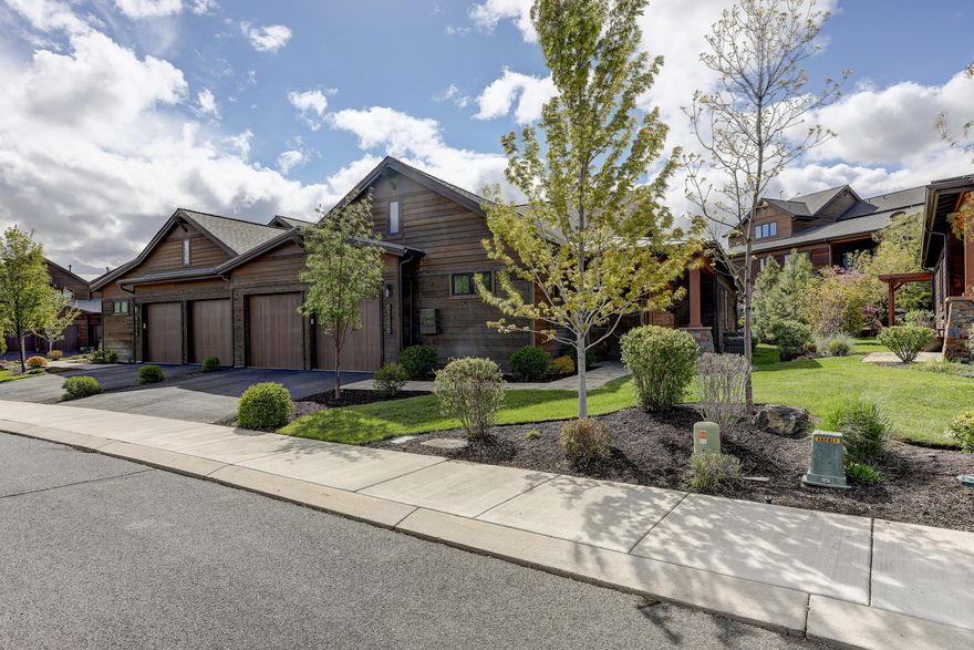 Wonderful single level, easy living townhome in Bend's most desirable Golf Course Community. Previous model home with no detail spared! Tour of Homes Best Kitchen, Best Interior Finish, Best of Show, and Best Feature of Outdoor Living Space. Extensive upgrades including Dansk Oregon Dunes Low Maintenance Hardwood Flooring throughout, Whirlpool Central Water Filtration System, remote control power window coverings & gas fireplace. Chef's kitchen with double islands, gorgeous cabinetry, s/s Jenn-Air appliances, quartz counter tops, wine cooler & open to the beamed vaulted great room. Nice separation of guest & owner bedroom suites. Large windows in owners suite brings the beautiful outdoor landscaping in. Great room French Doors open to the award winning paver patio, pergola & setting. All topped off with an oversized 562 Sq Ft garage, 22 feet in parking length