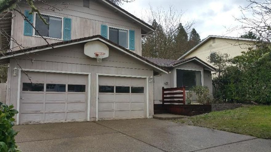 Tri-level on huge lot, new exterior paint in process, recently installed new heat pump, great layout with inviting front porch & entry into open living room/dining room w/slider to 3 tiered patio & cute kitchen with view of the entire huge backyard. Downstairs family room, with 1/2 bath & laundry room, has man door to tandem, finished garage w/dual openers, & also exits through slider to lower tier of back patio. Keep kids close w/upstairs bedrooms & full bath, & master suite with walk-in closet & add'l private bath w/shower. The backyard has been tiered for design appeal & usability, w/large lower level the size of many average yards, then up RR tie steps to 2nd garden plot area & several raised beds, & up even again to 3rd lawn & deck for lounging with a view! Mature landscaping includes many rose bushes, shrubs & trees. Sooo much potential with not too much effort! Information deemed reliable however Buyer to do own due