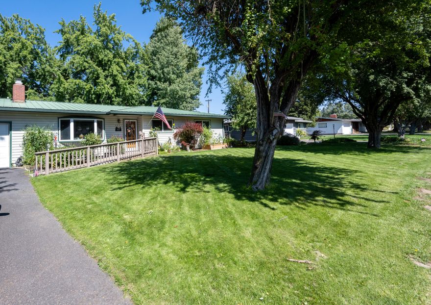 Spend your evenings outside on a large deck surrounded by mature landscaping and giant silver maple giving just enough shade. Updates throughout this cute home, include light fixtures, sinks, faucets, paint, sliding barn door, and newer appliances. In the winter enjoy the snowfall from your living room next to a cozy gas fireplace or while you sit in the hot tub off the deck. 2 water heaters, 2 heating/cooling units, a Rianbird inground sprinkler system, vinyl siding, and a metal roof to just name a few of the best features of this nice suburban home. In a highly desired neighborhood, come see it before it's too late.