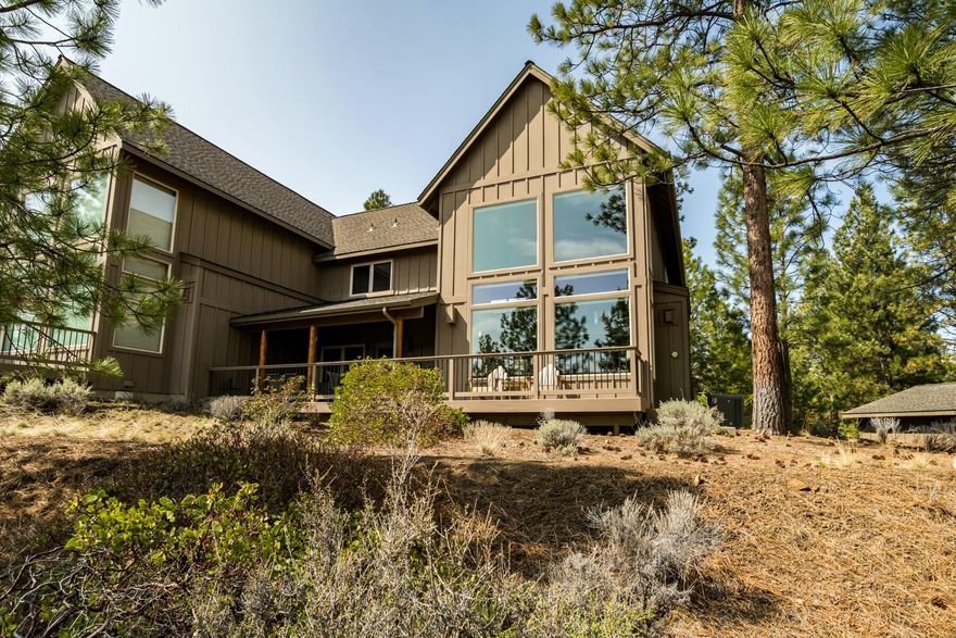 This meticulously maintained townhouse in the River Wild community offers stunning canyon and peek-a-boo river views from the patio. This home features a spacious open floor plan with soaring ceilings and abundant natural light. The main level includes a gourmet kitchen with granite countertops, Alderwood cabinets, and newer appliances, plus a living room with custom electric blinds, and a gas fireplace. The primary suite on the main level provides a private door to the deck/patio, walk-in closets, and an ensuite with a walk-in shower and a soaking tub. Upstairs, a versatile loft serves as a guest space or office with views to the living room and canyon. The home offers excellent guest separation with the second bedroom upstairs, a laundry room with built-in storage, and newer floors and carpet. The 2-car detached garage adds convenience and storage. All furniture is included in the sale, making this a turnkey property. Don't miss the chance to own this exceptional property!