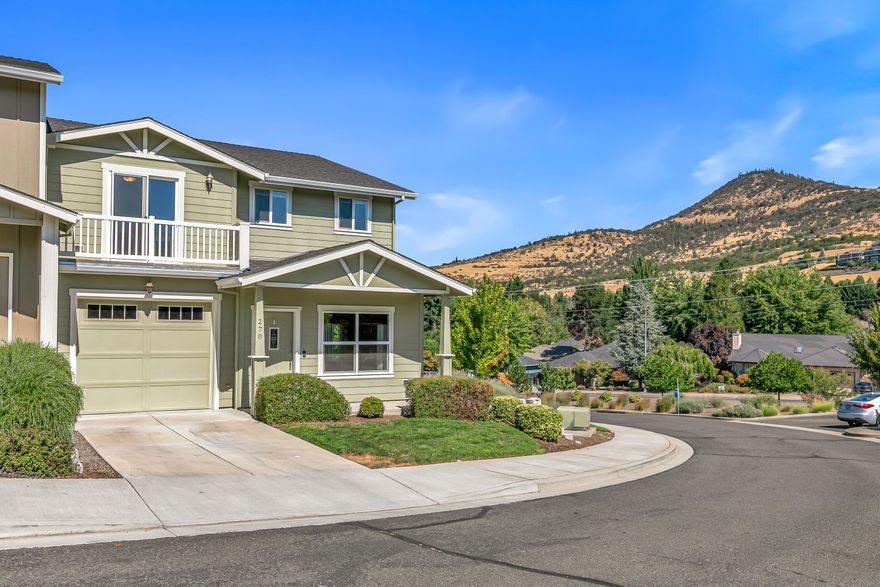 Spacious and move-in-ready end unit townhome located in the East Medford foothills within ten minutes of hiking, biking, equestrian trails, golf courses, and Asante Rogue Reg'l Medical Center. Seller-carried financing available! Main level primary suite with ceiling fan, sliding glass door to patio and fully-fenced private back yard, full ensuite bathroom with granite vanity, shower, huge storage area, and additional walk-in closet. Living, dining, powder room, pantry, and kitchen with vinyl plank floors. Granite dining counter, stainless appliances, and double sink with view of Roxy Ann Peak. Huge vaulted upper-level family room with ceiling fans, two bedrooms with walk-in closets, private view balcony, full bathroom with double granite vanity and tub shower, and laundry room with granite counter, utility sink, washer, and dryer. One car garage with built-in shelving. Association dues cover landscaping maintenance for front yards, side yards, and common areas. Inquire for details!