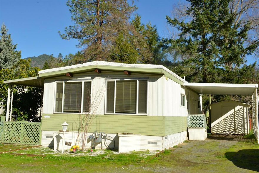Price Reduced! Priced to sell! Only $10,500 This cozy, comfortable 2 bedroom, 2 bath home has been well-maintained. The oven is a gas range. Has a washer and dryer. All appliances are included. It is nestled in a nice 55+ park just far enough out of town to enjoy a rustic, country atmosphere. Just minutes from shopping and eateries in Grants Pass. This 1971 double wide manufactured home has a pretty, fenced-in back yard and its own storage shed to store tools, crafts, etc. Don't wait to check this out, it won't be available for long at this price. Drastically reduced to $10,500! Call me now for an appointment to come see this sweet little home: 3764 Rogue River Hwy, #18. Located at Caveman Mobile Home Park, between Gordon Way and Whispering Pines Ln, Grants Pass