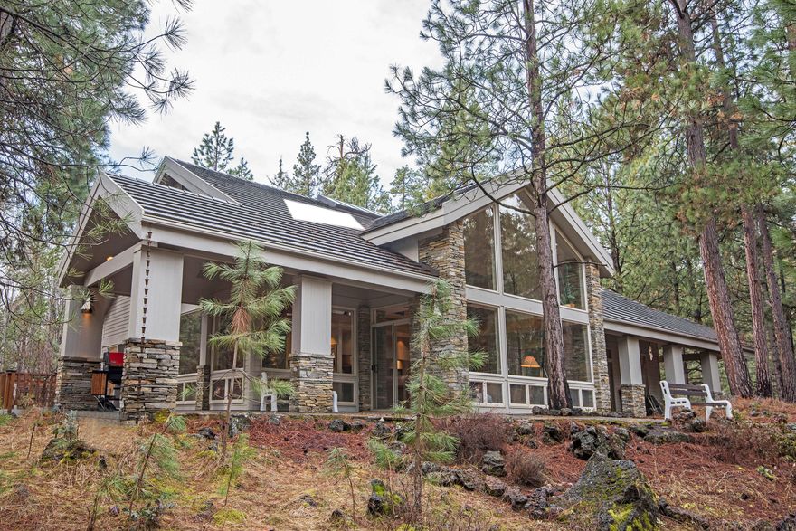 Breathtaking view of Black Butte to the front of the house. North and East of the house adjoins Deschutes National Forest, a wildlife haven. Unique steel frame house with Idaho quartz stone features, granite kitchen counters. South American hardwood floors in the great room. Two Masters on the main floor, plus a 3rd bedroom and bath. Large bonus room on the second floor being used as a bedroom. Three fireplaces, two propane only and one with a propane log lighter. See to appreciate the design and finishes. Comes with an electric player piano. Show by appointment only.