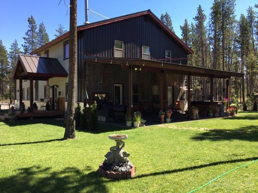 Great CUSTOM home, 3 bedroom, 2 bath home, 1992 sf on 1.14 acres, FULLY fenced & gated. Minutes to town on paved roads. Beautiful finishes inside & out. Open great room w/woodstove, slate GE appliances, pine flooring/trim, hickory cabinets, tile counter/flooring in bathrooms. HUGE 36x36 sf attached shop w/woodstove & tons of shelving for storage. Not to be missed, the LARGE covered patio for summer evening BBQ's & your very own HOT tub for star gazing! Property set up for horses, complete w/barn. Covered RV parking & hookups. Well for watering your yard.