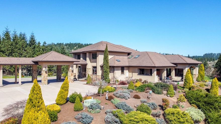 One of a kind, contemporary, Mediterranean style home in the heart of Wine Country. Approx 24 acres of rural secluded estate property, with extensive views to neighboring wineries. This home was on the 2011 Tour of Homes. Features 4,650 sq ft of living space with an addtl. 1,450 of covered outdoor area.  5 bedrooms, 3.5 bath. .  Concrete tile roofing with stucco exterior and natural stone accents.  Energy efficient design with natural ventilation and lighting.  Eco-Friendly home with Super Good Cents standards, ENERGY STAR appliances. Tankless water heaters, dual efficiency heat pumps with zoned/control/filtration and a rain water harvesting system for landscaping and organic gardening.  Gourmet kitchen with 2 islands, Sapale hardwood cabinets, granite countertops, finest appliances (WOLF and SUBZERO) Outdoor living w/fireplace, kitchen & entertaining areas.  Stamped/stained concrete patios & driveway.   3 car garage with office and bathroom & covered porta cochere.  Lg metal building