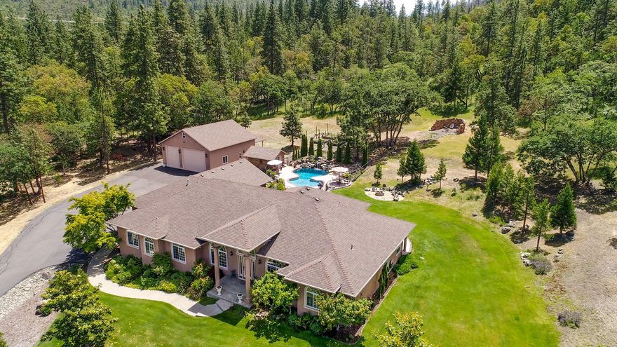 Secluded East Medford gated community on city water & natural gas service! Doctors & professionals enjoy the short 10-minute commute to medical facilities & offices. Impeccably maintained! Custom built single-level home on over 10 acres. Floor plan offers formal dining & living rooms, family room w/gas fireplace, dining nook w/double-sided gas fireplace shared w/living room. Kitchen has large eating bar, granite counters, dble wall ovens, gas cooktop. Spacious master suite w/newer cork flooring, jetted tub, walk-in shower, 2 sink vanities. New HVAC system! Oversized 2 car attached garage. Detached 1,400 sq. ft. shop/garage w/640 sq. ft. unfinished loft. Outdoor kitchen: sink, fridge, BBQ, ice maker. 2 firepits. Fenced garden w/raised beds. Gas heated in-ground saltwater pool w/waterfall feature.  Beautiful mountain & valley views! Incredible hiking, biking, or horseback riding awaits new owners.  One owner is a licensed real estate agent in the state of Oregon.