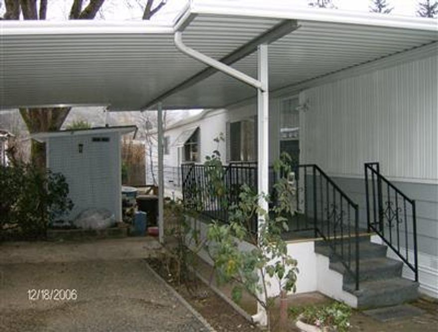 charming, well-kept sgl.-wide in quiet Senior park. Includes all appliances,2 outside sheds, covered porches both sides of house,covered carport- extras inside such as: built-in counters and shelves,bay windows,etc.- nice spacious yard. - very liveable and cozy