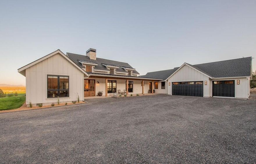 Wake up to sweeping sunrise views and wide-open skies from this private 17.5-acre estate, nestled in Redmond's countryside with close proximity to Sisters and Bend. The property features a custom crafted single-level home with soaring ceilings, a gracious floor plan, wood-burning fireplace, and expansive windows that fill the interior with natural light. A wall of panoramic multi-slide doors anchors the great room, opening the home to its stunning natural surroundings. A chef's kitchen boasts premium Thermador appliances, an oversized island, granite and quartz counters, and custom cabinetry- perfect for gourmet cooking and effortless entertaining. Outside, enjoy low-maintenance living, abundant wildlife, and access to adjacent BLM land and the nearby river. Thoughtfully situated to maximize privacy and capture uninterrupted views, this estate offers a rare blend of sophistication and timeless charm in the heart of rural living. Agent is also the seller.