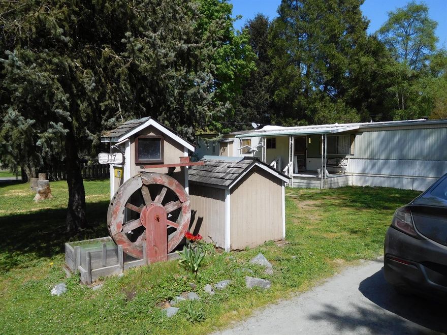 County has the mobile as a 2bd, 2 bath of 1174 sq ft, Has had some additions to it to increase size and space. Mobile is livable, Just needs some TLC, or live in it while building your own! Flat lot is clean with a detached 2 car garage with good sized shop in back. Car port and shed also. Quiet little spot just minutes from shopping and medical. Raised beds ready for your garden! GPID water.