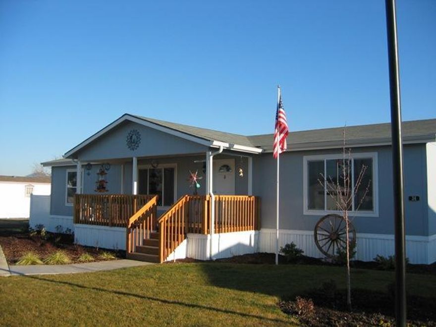 Beautiful 2008 Fleetwood home in Cobblestone Village 55+ over community. This home has a 5 star energy rating. 2 solar tubes-1 Large skylight in the kitchen. There is a 22x26 attached finished garage with 220 amp power. RV hook up. Custom paint on interior and beautiful light & bright floorplan. Full walk-in pantry,beautiful knotty older cabinetry in kit,lrg upper mstr w/dbl vanity in bath suite, upgraded water filtration & air filtration systems. A must tour home with unbelievable upgrades. Cobblestone Village is a manufactured home and RV park.