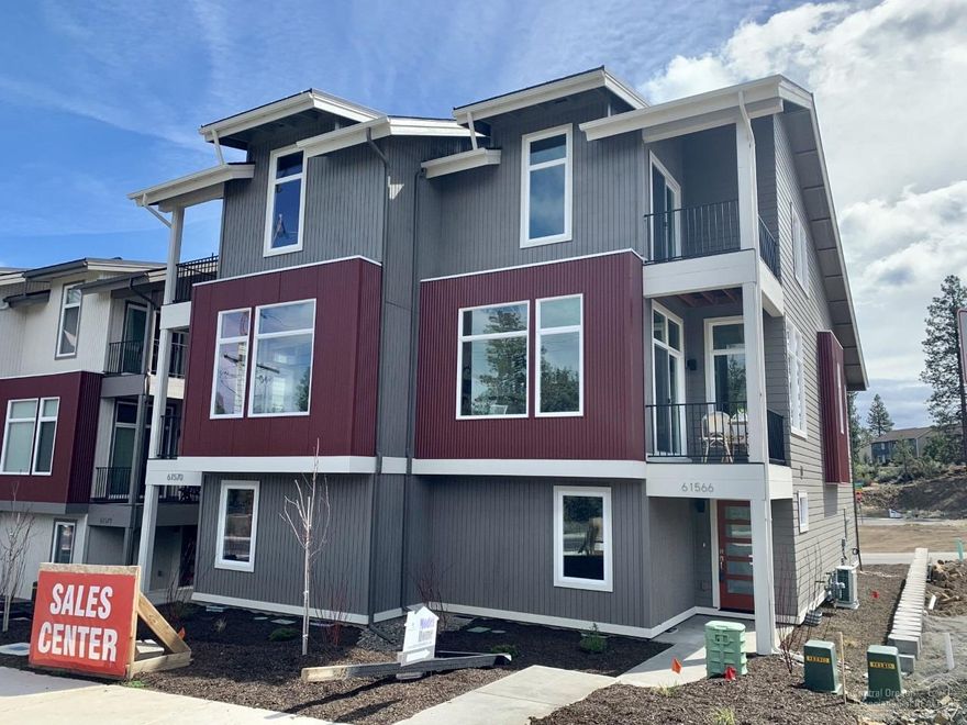 Finally, a home that reflects the Bend lifestyle! Live near the action in this beautifully and thoughtfully designed home. Located in the Riverwalk addition. Townhouse by Malace Homes is located near the coveted Old Mill District. Hit the trails as you walk out your front door and head to the Deschutes River or jump in the car and take a short trip to Mt Bachelor. All are within reach from a home that fits your active lifestyle. This Earth Advantage Gold Certified home features high-end luxurious finishes at an affordable price. As you walk in the home from your finished 2 car garage you will notice a beautiful tile floor entrance and designer finishes. The first floor features a bedroom set up like a suite with a full bathroom, quartz counter tops and custom cabinetry, 2-washer and dryer hookups, and plenty of storage. Moving upstairs the main living area features an open great room concept,with high ceilings, large windows,soft close drawers and an Energy efficient electric fireplace